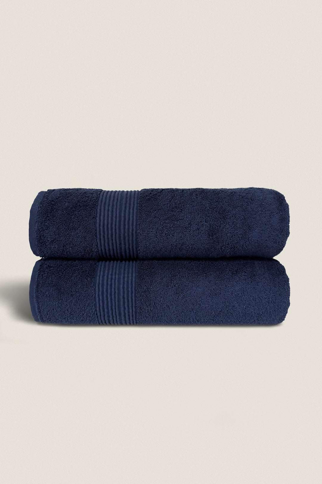 Elegant bath towel set bundles neatly stacked, showcasing soft, plush textures and coordinated colors for a luxurious bathroom look