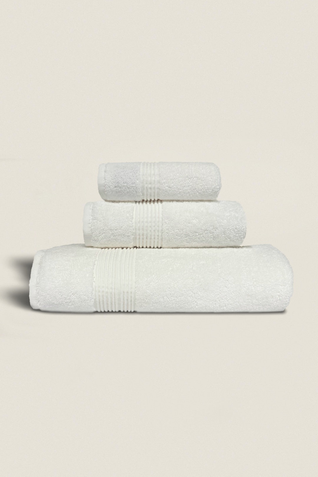Elegant bath towel set bundles neatly stacked, showcasing soft, plush textures and coordinated colors for a luxurious bathroom look