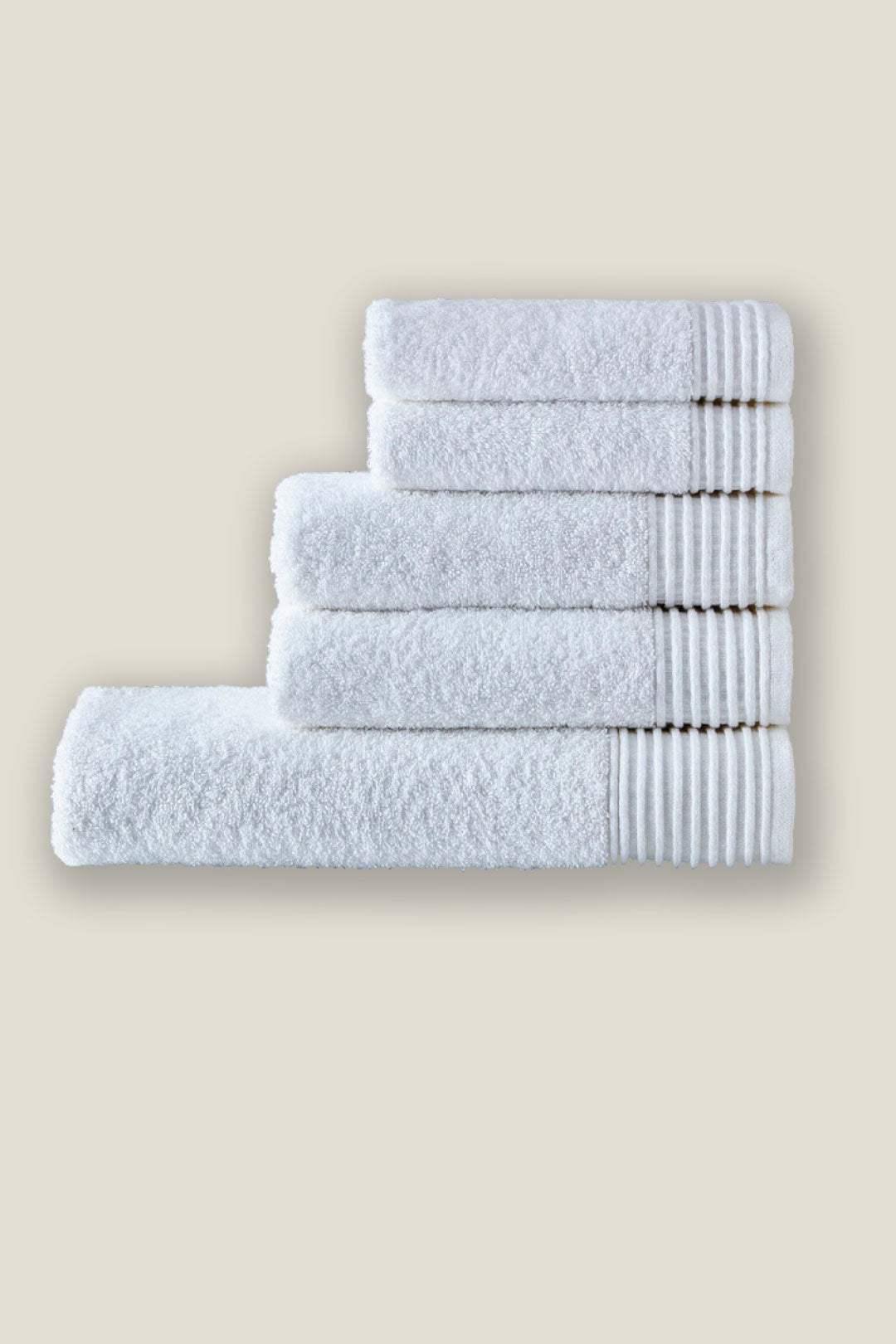Premium white hotel towels stacked neatly, featuring soft, durable, and highly absorbent cotton ideal for luxury hospitality and spa use